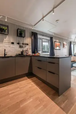 a kitchen with a large island in a room at Ledig vinterferien er en stor ski in out leilighet med panoramautsikt over Hemsedal in Hemsedal