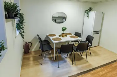 a dining room with a white table and chairs at Stylish place in the heart of Bergen in Bergen