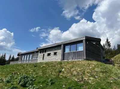 a house sitting on top of a hill at Moderne hytte Sjusjøen in Sjusjøen