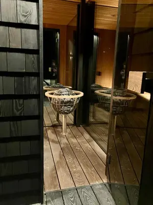 a reflection of a room with two tables in a mirror at Glimre Romsdal - Eksklusivt speilhus ved Åndalsnes in Isfjorden