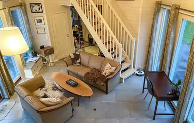 a living room with a couch and a table at Beautiful Home In Skodje in Vatne