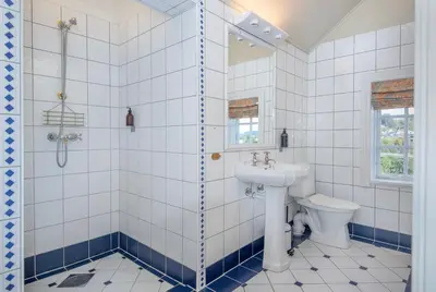 a bathroom with a shower and a sink and a toilet at Jervell 3 Bnb in Ålesund
