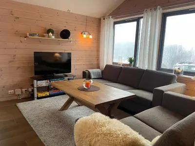 a living room with a couch and a coffee table at Perfect Family Base In Beitostølen in Beitostøl