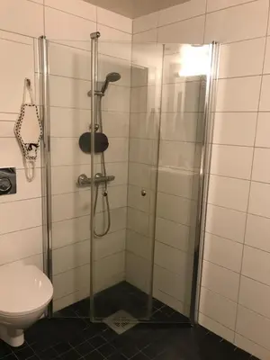 a bathroom with a shower and a toilet at Ski VM i Trondheim 2025 in Trondheim
