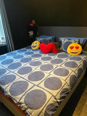 two stuffed animals are sitting on a bed at Bergen peaceful loft in Bergen