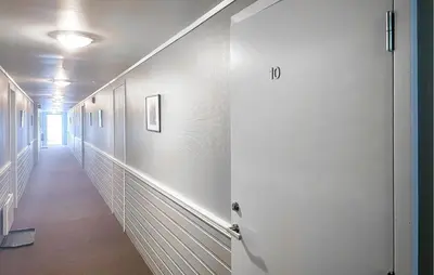 an empty hallway with a white door and a hallway sidx sidx at Lovely Apartment In Bjorli With Sauna in Bjorli