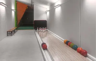 a bowling alley with a line of balls on the lanes at Lovely Apartment In Bjorli With Sauna in Bjorli
