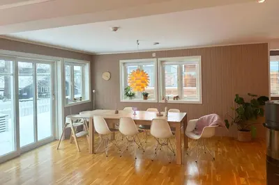 a dining room with a table and chairs at Stor enebolig i Trondheim in Trondheim