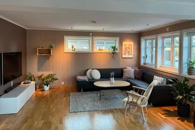 a living room with a couch and a table at Stor enebolig i Trondheim in Trondheim