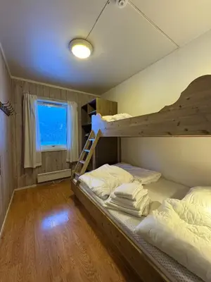 two bunk beds in a room with a window at Spacious apartment near Hemsedal ski resort in Hemsedal