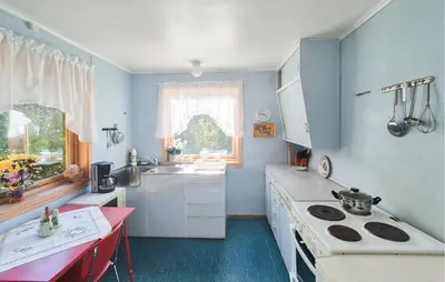 a kitchen with a sink and a stove top oven at 3 Bedroom Amazing Home In Reksteren in Haukafer