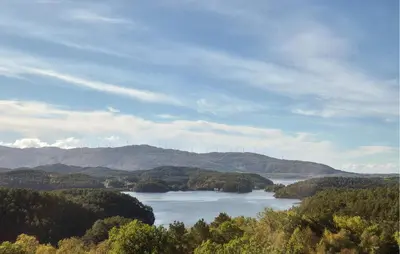 a view of a river with trees and mountains at 3 Bedroom Amazing Home In Reksteren in Haukafer