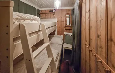 a small room with a bunk bed and a bunk bed at 3 Bedroom Nice Home In Tuddal in Tuddal