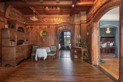 an ornate dining room with a table and chairs at Jervell 4 Bnb in Ålesund