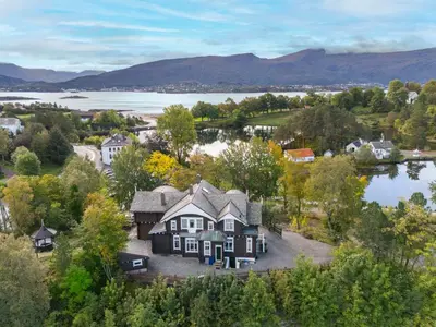 an aerial view of a house with a lake at Jervell 4 Bnb in Ålesund