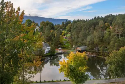 a view of a river with houses and trees at Jervell 4 Bnb in Ålesund