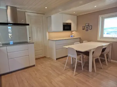 a kitchen with a table and chairs in a room at Ski VM 2025 Hus 20 min til Granåsen og trdh in Melhus