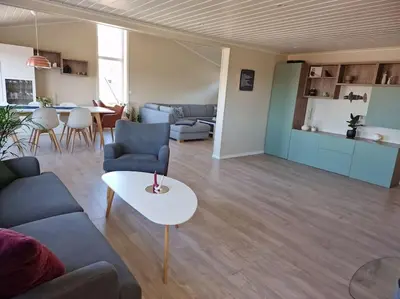 a living room with a couch and a table at Ski VM 2025 Hus 20 min til Granåsen og trdh in Melhus