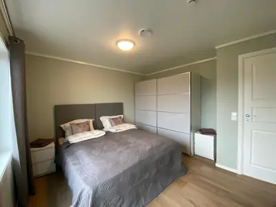 a bedroom with a bed with two pillows on it at Leilighet på Hardbakke in Lia