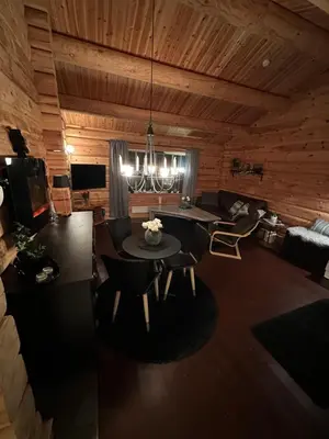 a living room with a table and chairs in a cabin at Hytte Oppdal Så Klart in Oppdal