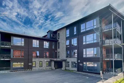 an empty parking lot in front of a building at Modern Apartment in Trysil Lodge Ski in out in Trysil