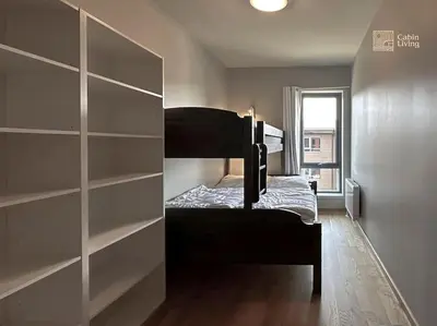 a small room with a bunk bed and a window at Modern Apartment in Trysil Lodge Ski in out in Trysil