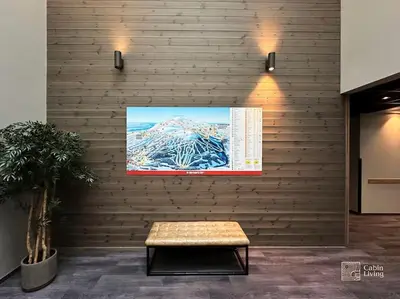 a wall with a bench and a screen on it at Modern Apartment in Trysil Lodge Ski in out in Trysil