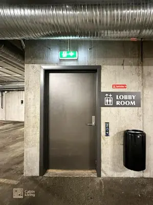 a door in a building with a sign above it at Modern Apartment in Trysil Lodge Ski in out in Trysil