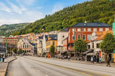 a view of a street in a town with a mountain at Dinbnb Appartments l Live in a postcard ! l 300 m To Bryggen l Value! in Bergen
