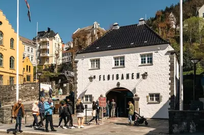 a group of people standing in front of a building at Dinbnb Appartments l Live in a postcard ! l 300 m To Bryggen l Value! in Bergen