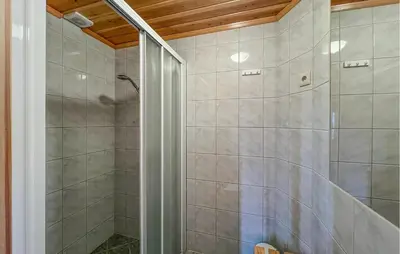 a shower with a glass door in a bathroom at 4 Bedroom Gorgeous Home In Bagn in Bagn
