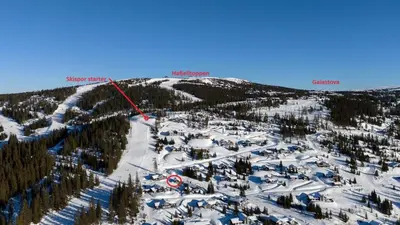 an aerial view of a ski resort in the snow at Modern apartment with ski in out in Hafjell in Hafjell