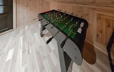 a table with a hockey game on it in a room at Gorgeous Home In Gol With Sauna in Gol