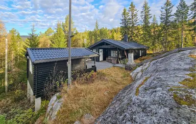 a small cabin in the middle of a forest at 3 Bedroom Amazing Home In Eggedal in Eggedal