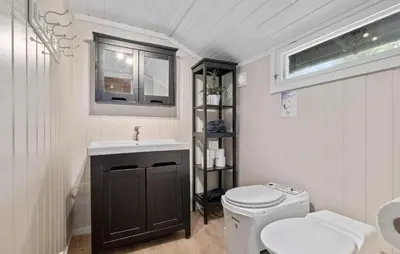 a white bathroom with a toilet and a sink at 3 Bedroom Amazing Home In Eggedal in Eggedal