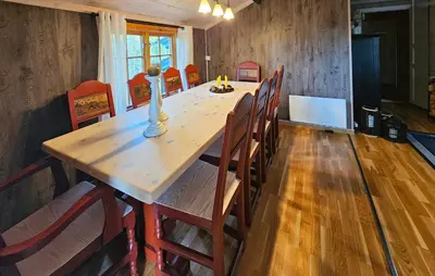 a dining room with a long wooden table and chairs at 3 Bedroom Amazing Home In Eggedal in Eggedal