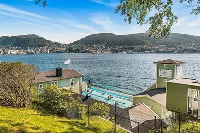 a view of a large body of water with houses at Dinbnb Appartments l Traditional bergenshouse I Charming I Familiy in Bergen