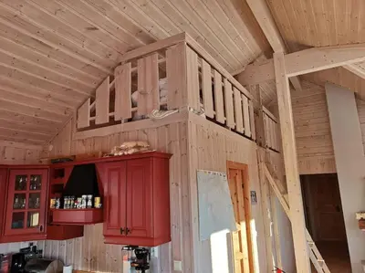 a wooden room with a shelf on the wall at Høyfjellshytte in Flå