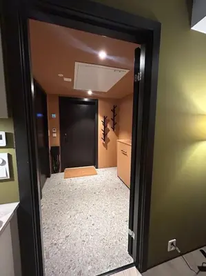 a hallway with a door leading into a room at Ski-in ski-out - Hemsedal Fjellandsbyen in Hemsedal