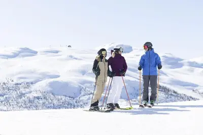 three people on skis standing in the snow at Ski-in ski-out - Hemsedal in Fjellandsbyen - view to the slopes in Hemsedal