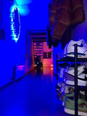 a room with a bed with blue and purple lights at Top Floor Apartment Trondheim in Trondheim