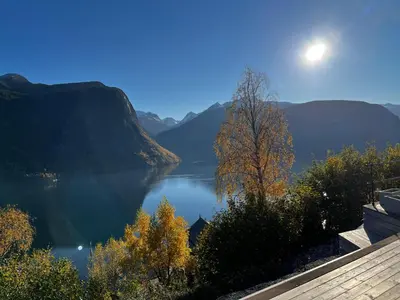 a view of a large body of water with mountains at Chalet with amazing fjord view in Lingåsen in Valldal