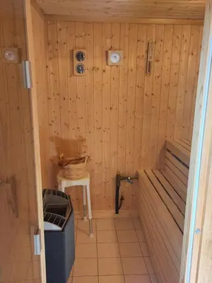 a small sauna with a sink and a table at Coazy cabin with sauna in Trysil