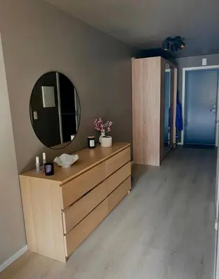 a bathroom with a mirror and a wooden dresser at Lægdgrinda 11 in Trondheim