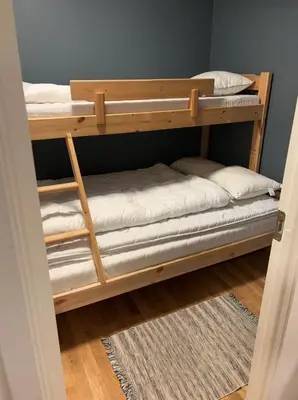 a couple of bunk beds in a room at Røldal a home with a view in Håra