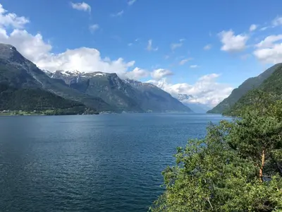 a view of a lake with mountains in the background at Røldal a home with a view in Håra