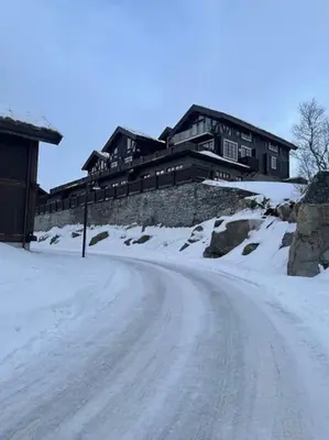 a house on top of a snow covered hill at Hovden Alpin Lodge! Ski in out in Hovden