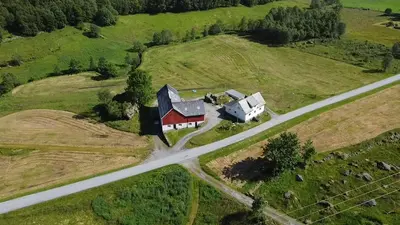 an aerial view of a house and a road at Hus i Syvde in Sylte
