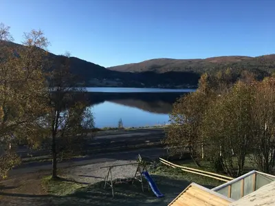 a view of a lake with mountains in the background at Voss- Myrkdalen Lodge in Vossestrand