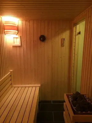 a small room with a sauna with a wooden floor at Voss- Myrkdalen Lodge in Vossestrand